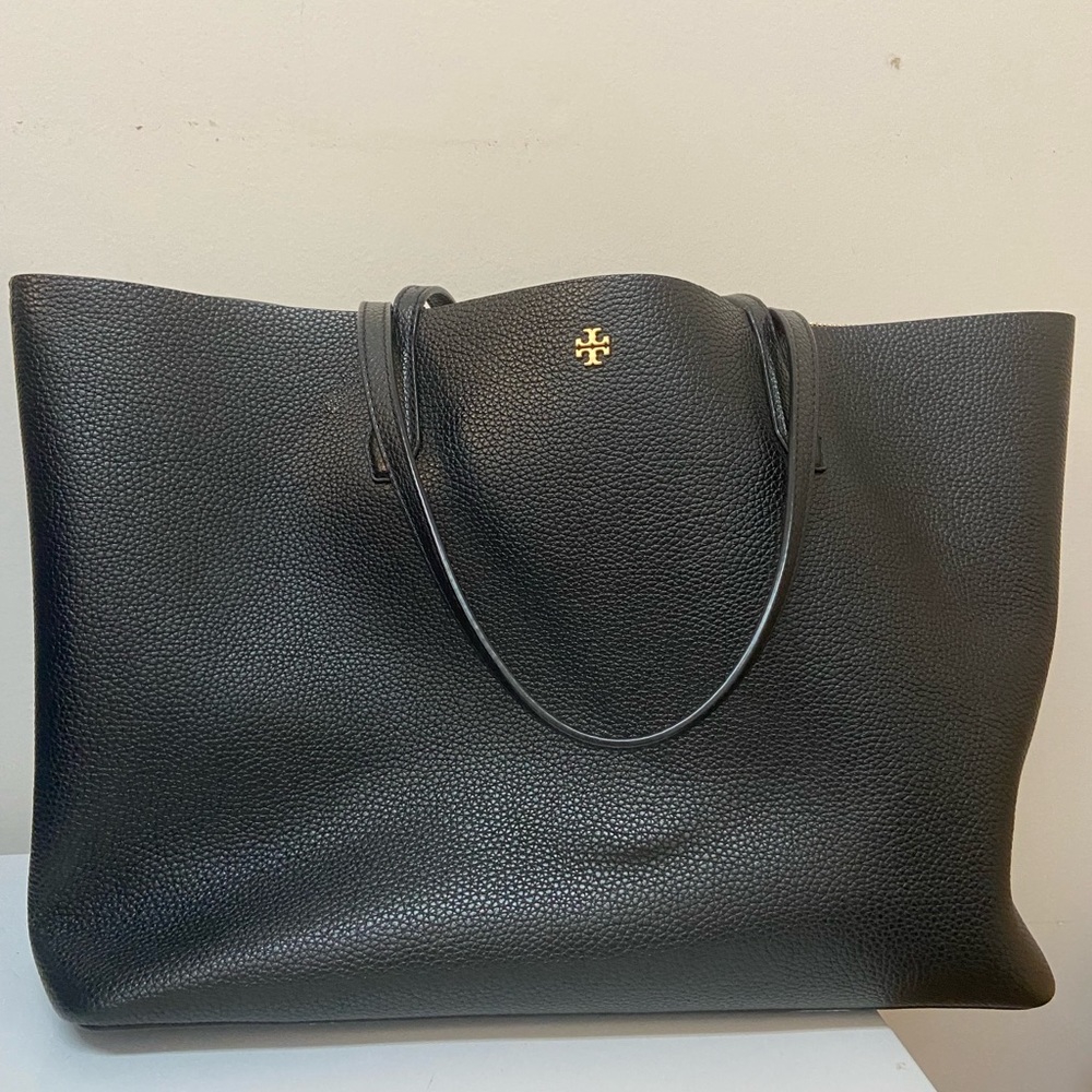 Gently used Tory Burch tote in black . Only used 6-7 times.